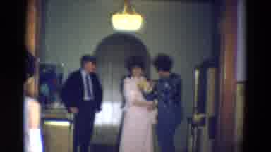Diller Nebraska (1969): Seamstress Is Fixing A Woman's Dress On Her While A Man Is