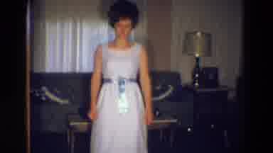 Diller Nebraska (1969): An Unhappy Woman Wearing A Formal Gown And A Beehive