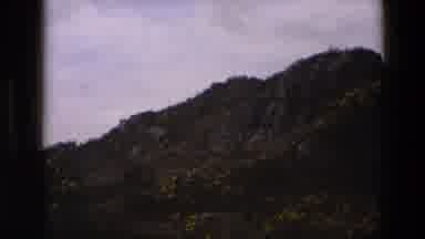 England-1969: Hillside On The Side Of The Road With Rocks And Dirt