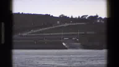 England (1969): White Building Next To The Water Looks Calm And Peaceful
