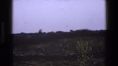 England (1969): A View Of The Field Filled With Lush Green Grasses And Tall Trees