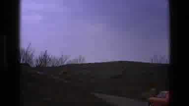 England (1969): Red Car Driving Away Through Rural Landscape