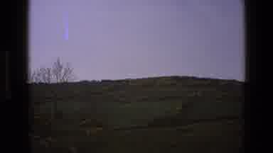 England (1969): A Hillside Covered With Green Grass And Small Bushes On A Sunny