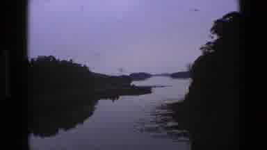 England (1969): Tree And Sky Reflections On Still River Water At Dusk
