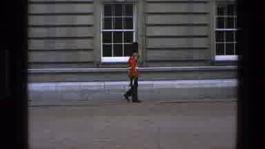 England (1969): Man Soldier Marching Walking Gun Building Door Windows Uniform