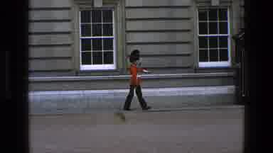 England (1969): A British Royal Guard Walks Along His Post With His Rifle