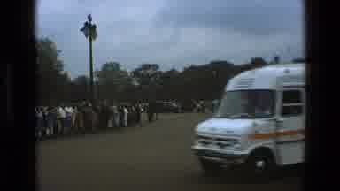England (1969): Horses With Men Riding Beside Crowd Of Onlookers As Cars Drive By