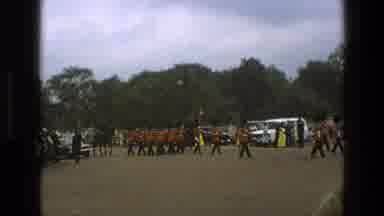England (1969): British Soldiers Marching Down Street Toward Palace With Flag And