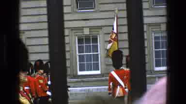 England (1969): Soldiers In Red At The Palace Viewed Through Black Bars