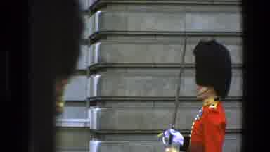 England (1969): Soldier In Red Uniform With Large Black Ornamental Headdress And