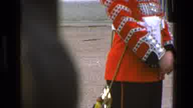 England (1969): People Watching A Parade With Bands And Others