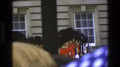 England (1969): Guards In Uniform Stand Before A Crowd