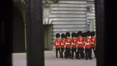 England (1969): A Group Of Buckingham Palace Guards On The March In Famous Red