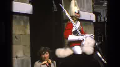 England (1969): Tourist Having Video Taken Of Them In Front Of A Mounted Honor