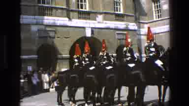 England (1969): Guards Wearing Red Black And White Uniforms Sitting On Black