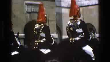 England (1969): Guards Wearing Red Black And White Uniforms Sitting On Black