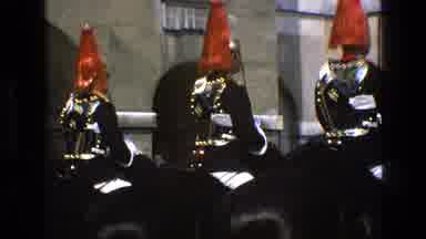 England (1969): Armored Soldiers On Horseback In Front Of Buildings Outdoors Sunny