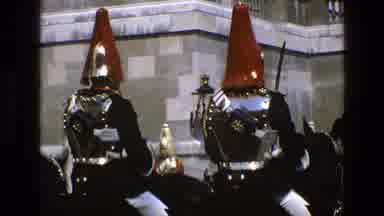 England (1969): Soldiers In Dress Uniform Ride Horses While Another Walks In Front