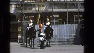 England (1969): The Man In Fancy Military Uniform Marches With A Sword In Front Of