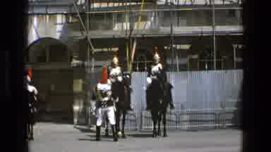 England (1969): Guards Wearing Elaborate Metal Armor And Headpieces Riding Horses