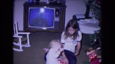 Fort Wayne Indiana (1969): Baby Plays With The Ribbon On The Christmas Gift So
