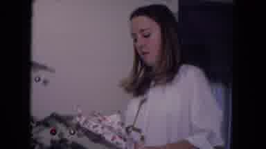 Fort Wayne Indiana (1969): Mother Watches Her Daughter Unwrap A Christmas Gift