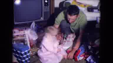 Fort Wayne Indiana (1969): Th Dad Is Playing With His Kid While The Mom Is Away