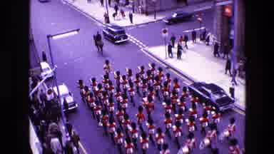 Ireland (1969): Vibrant Marching Band With Instruments Parades Through City