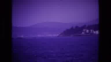 Ireland (1969): View Of Blue Ocean White Building Sand Mist Covered Mountain On A