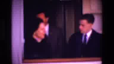 Ireland (1969): Two Men Dresses In Suits Inside A Building Standing Behind A Lady