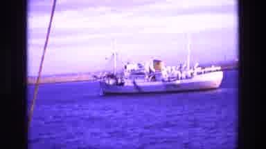Ireland (1969): White Boat Floats In Open Water On A Bright Sunny Day