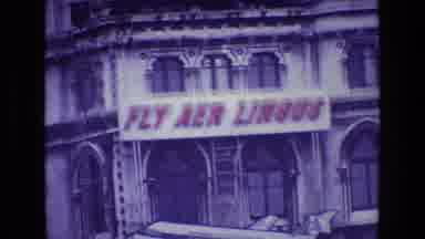 Ireland (1969): Zooming In On A Building With Advertising For Fly Aer Lingus