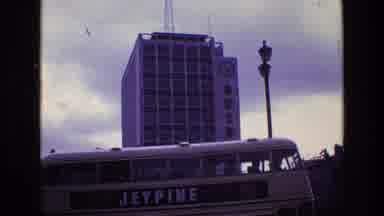 Ireland (1969): London Tour Bus Turns Corner Of City Street