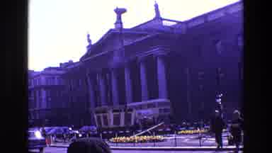 Ireland (1969): Sixties Double Decker Bus Driving By A Columned Federal Building