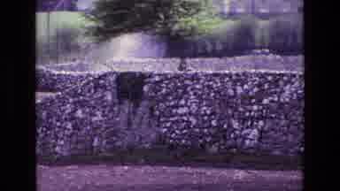 Ireland (1969): Tall Stone Wall Hides The Yard Of The House As The Camera Pans