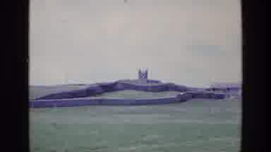 Ireland (1969): View Of Green Fieldstone Gates And Building On A Clear Day