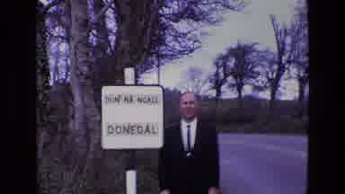 Ireland (1969): Man Street Trees Nature Talking Cloudy Day Sign Standing Wild