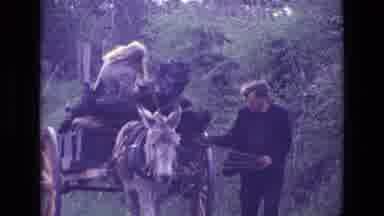 Ireland (1969): Man Leading Donkey Pulling Cart With Person Aboard Down A Rural