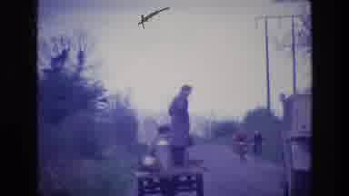 Ireland (1969): A Man Stands On A Cart As It's Pulled Along A Road