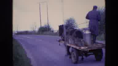 Ireland (1969): Milkman Rides Horse And Buggy Down Road In The Middle Of A