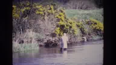Ireland (1969): Person In Boots And Cat Slowly Wading Across A River Looking At