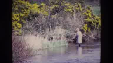 Ireland (1969): Pearson Slowly Wading Across A River In Wading Boots And Jacket