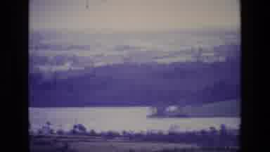 Ireland (1969): Lake At Foot Of Hill Has Dark Forest Beyond It