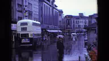 Ireland (1969): People Walk Down Busy Street In The Rain