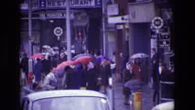 Ireland (1969): Very Busy City Landscape On A Rainy Day With Many People Buildings