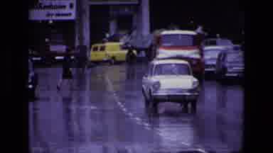 Ireland (1969): A Clock Tower And A Busy City Life In A Rainy Day