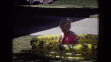 White Sands Florida-1970: Small Blonde Girl Playing In Inflatable Pool With Red Ball