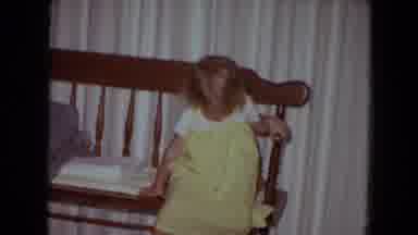 White Sands Florida (1970): Young Child In Yellow Dress Poses On A Wooden Seat For