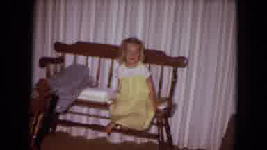 White Sands Florida (1970): Girl Wearing Yellow Dress Sits On Brown A Wooden Bench