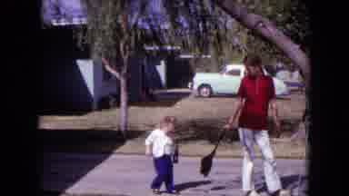 White Sands Florida (1970): Mother And Kid Walk Front Of The House In The Morning
